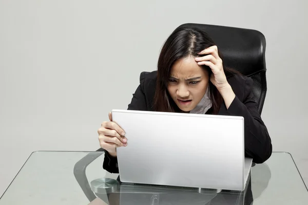 Bored woman at her desk — Stock Photo, Image