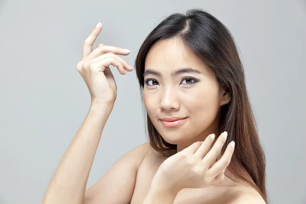 Portrait of a beautiful female model on isolated gray background — Stock Photo, Image