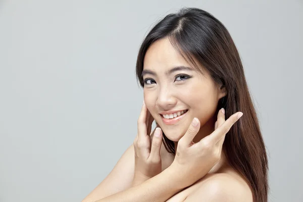 Portrait of a beautiful female model on isolated gray background — Stock Photo, Image