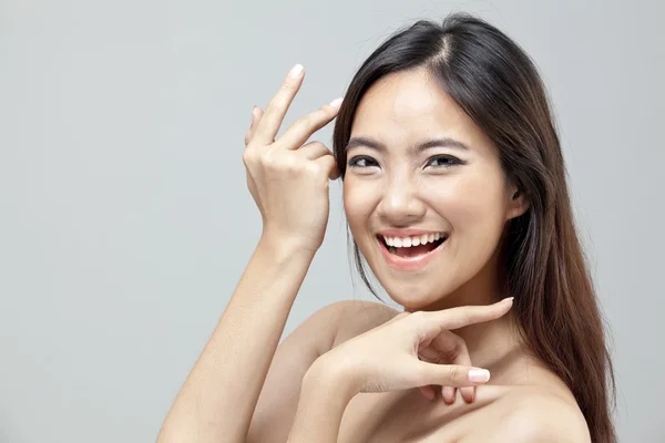 Portrait of a beautiful female model on isolated gray background — Stock Photo, Image