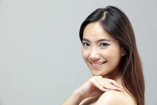 Portrait of a beautiful female model on isolated gray background — Stock Photo, Image