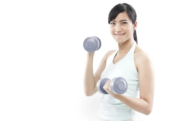 Beautiful asian woman with dumbbells — Stock Photo, Image