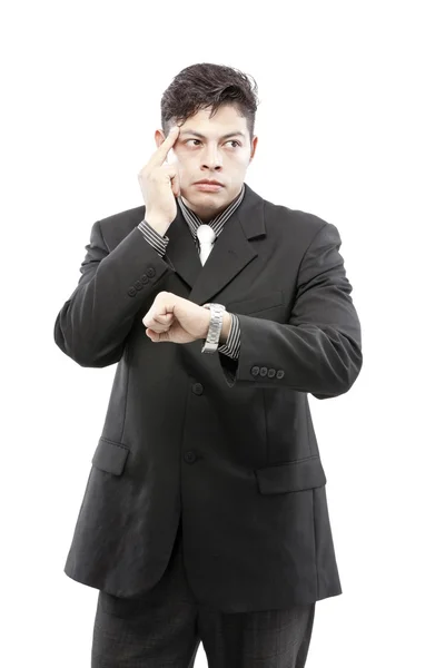 Geschäftsmann schaut auf die Zeit und denkt nach — Stockfoto