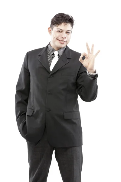 Friendly and smiling businessman showing OK sign — Stock Photo, Image