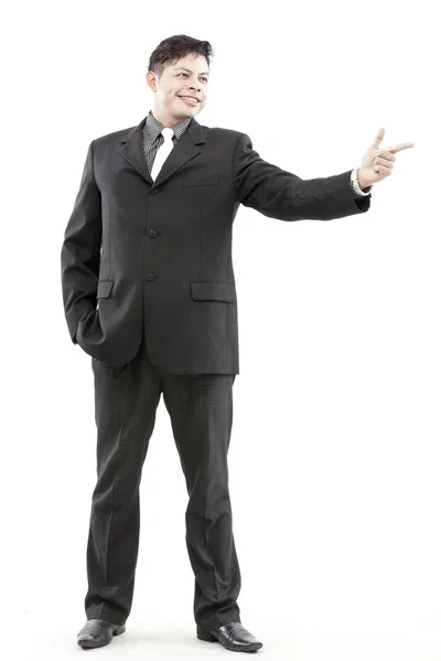 Photo of a handsome young businessman pointing to something — Stock Photo, Image