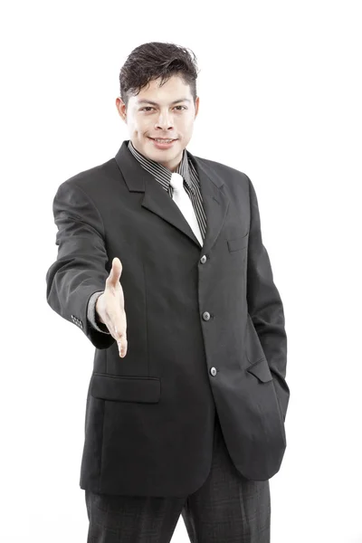 Homem de negócios feliz com uma mão aberta pronta para fechar um negócio. Isolado sobre fundo branco . — Fotografia de Stock