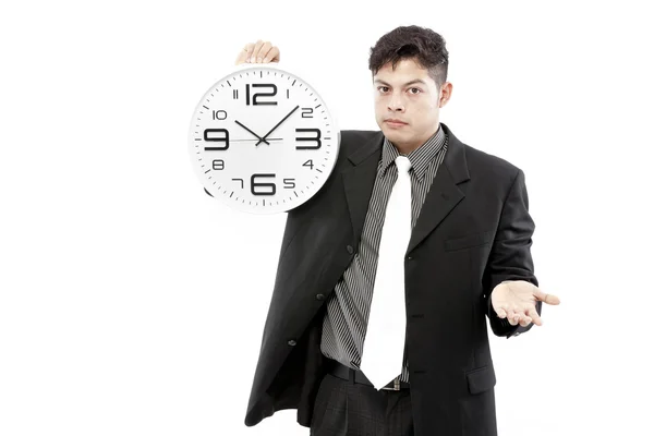 Portrait d'un homme d'affaires tenant une horloge sur fond blanc — Photo