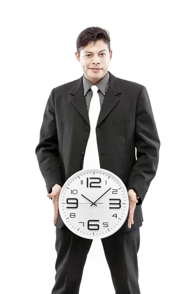 Portrait d'un homme d'affaires tenant une horloge sur fond blanc — Photo