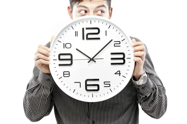 Concept de temps, Homme d'affaires tenant une grande horloge et donner l'expression sur son visage — Photo