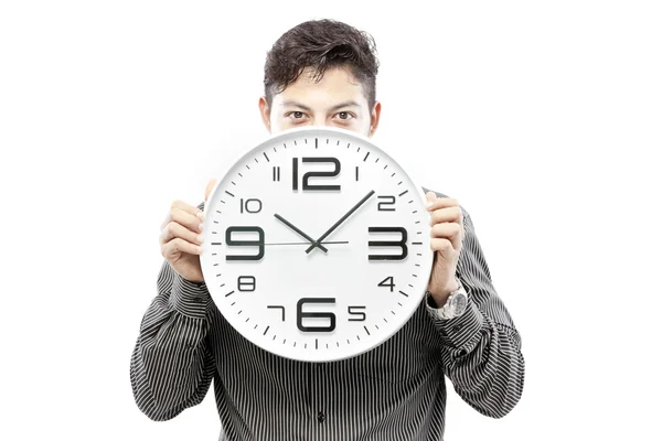 Concepto de tiempo, hombre de negocios sosteniendo gran reloj y dar la expresión en su cara — Foto de Stock