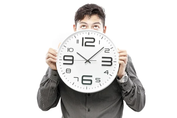 Concepto de tiempo, hombre de negocios sosteniendo gran reloj y dar la expresión en su cara — Foto de Stock