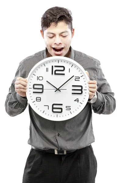 Concepto de tiempo, hombre de negocios sosteniendo gran reloj y dar la expresión en su cara — Foto de Stock