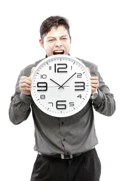 Concepto de tiempo, hombre de negocios sosteniendo gran reloj y dar la expresión en su cara —  Fotos de Stock