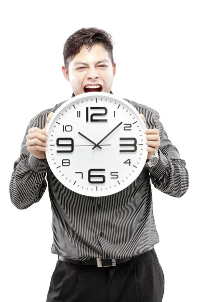 Concepto de tiempo, hombre de negocios sosteniendo gran reloj y dar la expresión en su cara — Foto de Stock