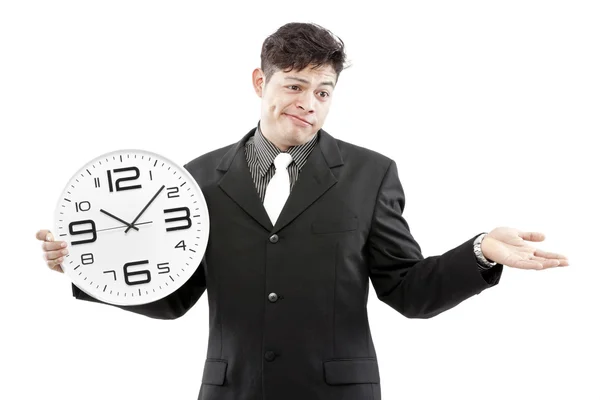 Concepto de tiempo, hombre de negocios sosteniendo gran reloj y dar la expresión en su cara — Foto de Stock