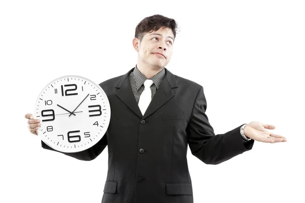 Concepto de tiempo, hombre de negocios sosteniendo gran reloj y dar la expresión en su cara — Foto de Stock