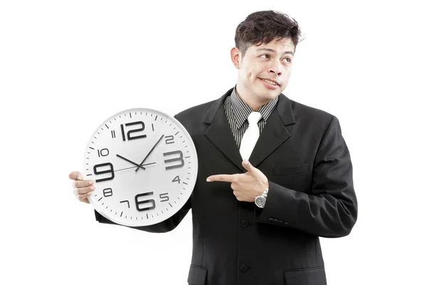 Uomo d'affari in piedi ed esprimere il suo emotivo mentre tiene l'orologio in mano . — Foto Stock