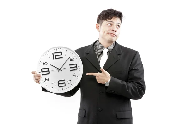 Empresario de pie y expresar su emoción mientras sostiene el reloj en su mano . — Foto de Stock