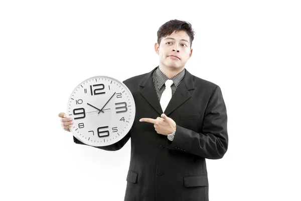 Empresario de pie y expresar su emoción mientras sostiene el reloj en su mano . — Foto de Stock