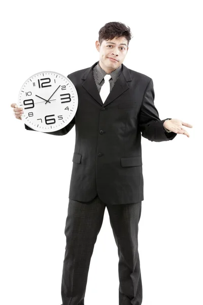 Concepto de tiempo, hombre de negocios sosteniendo gran reloj y dar la expresión en su cara — Foto de Stock