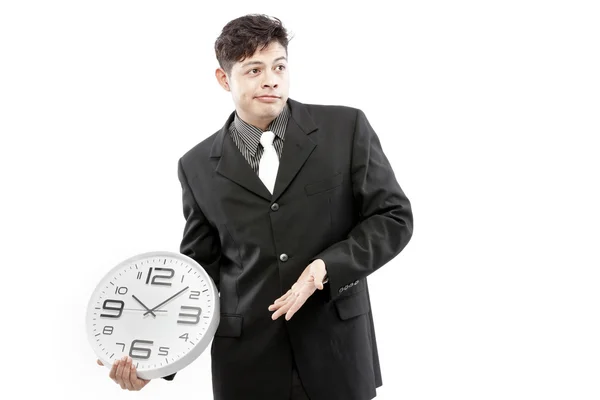 Affärsman står och uttrycka sin känslomässiga samtidigt hålla klockan i handen. — Stockfoto