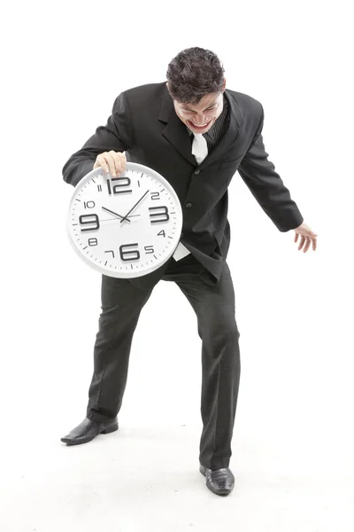 Portrait of a businessman putting the clock — Stock Photo, Image
