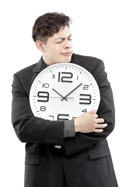 Conservación de los tiempos, primer plano del joven empresario con reloj analógico aislado sobre fondo blanco — Foto de Stock