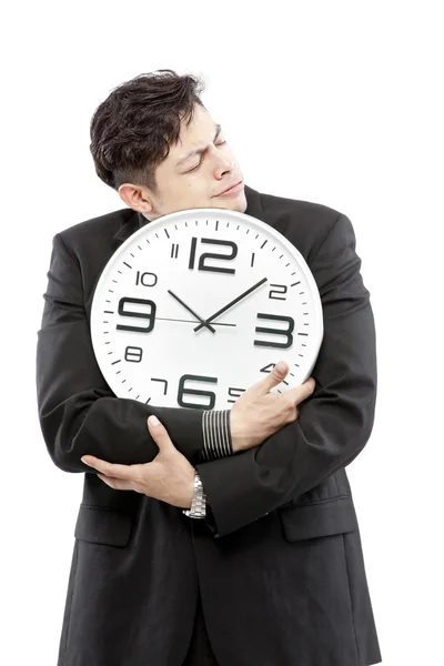 Préservation des temps, gros plan de jeune homme d'affaires avec horloge analogique isolé sur fond blanc — Photo