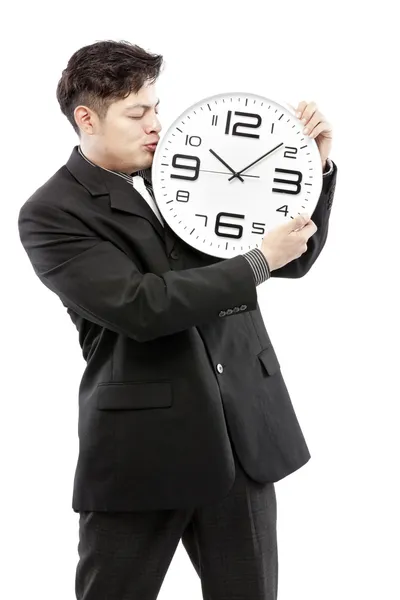 Préservation des temps, gros plan de jeune homme d'affaires avec horloge analogique isolé sur fond blanc — Photo
