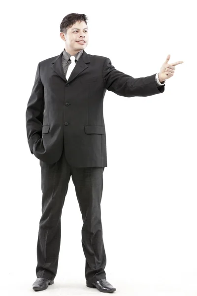 Photo of a handsome young businessman pointing to something Stock Image