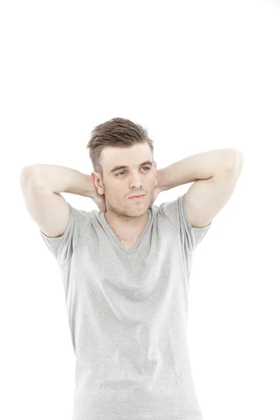 Hombre casual pensando con su camiseta gris en blanco aislada sobre fondo blanco — Foto de Stock