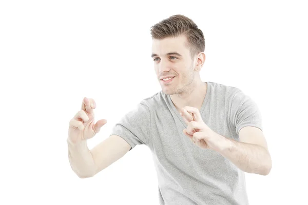 Handsome man casually with fingers crossed on isolated white background — Stock Photo, Image
