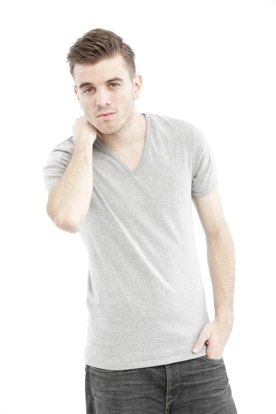 Casual man thinking with his blank gray t-shirt isolated on white background Stock Photo