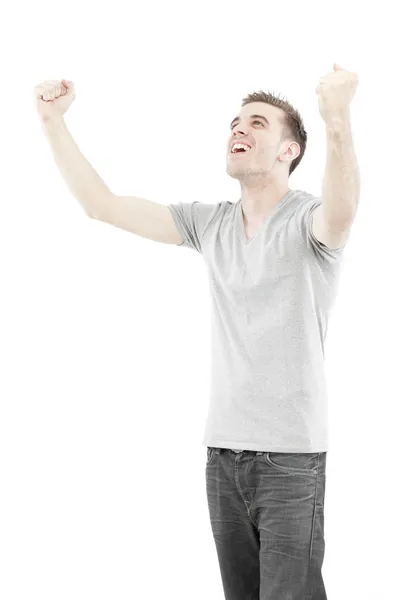 Hombre casual disfrutando de su éxito aislado sobre fondo blanco Fotos de stock libres de derechos