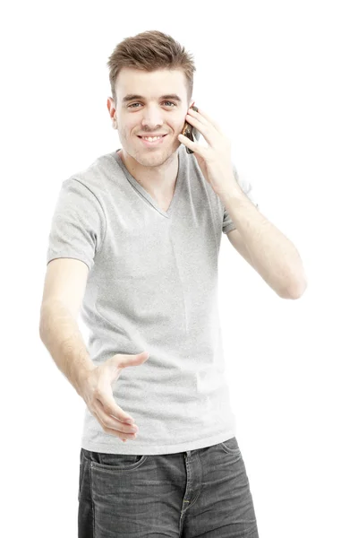 Young man talking on his smart phone — Stock Photo, Image
