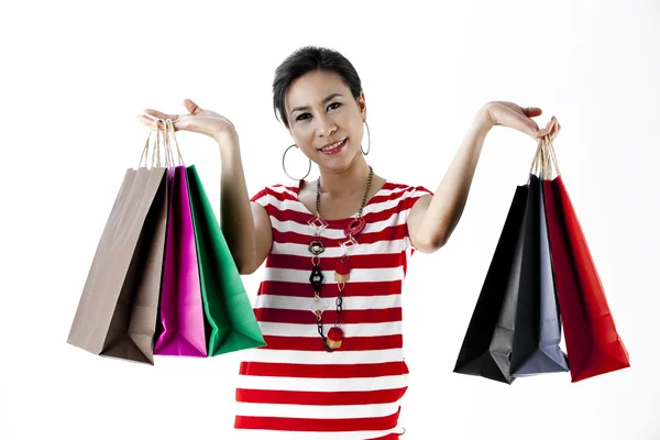 Hermosa mujer con un montón de bolsas de compras —  Fotos de Stock