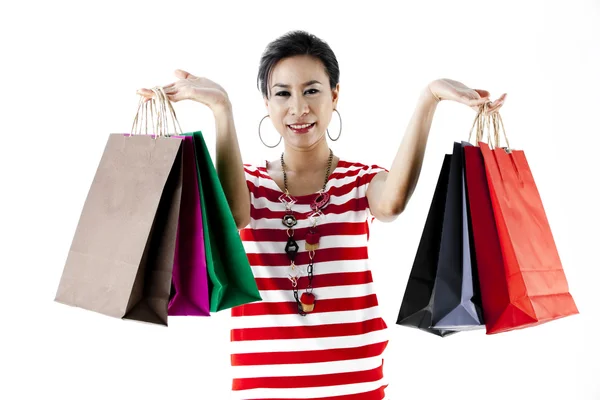 Hermosa mujer con un montón de bolsas de compras —  Fotos de Stock