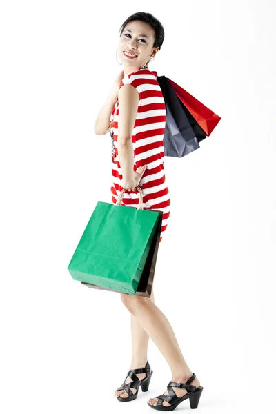 Mulher bonita com um monte de sacos de compras — Fotografia de Stock