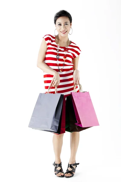 Krásná žena s mnoha nákupní tašky — Stock fotografie