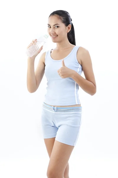 Sporty woman drinking water, isolated against white background — Stock Photo, Image