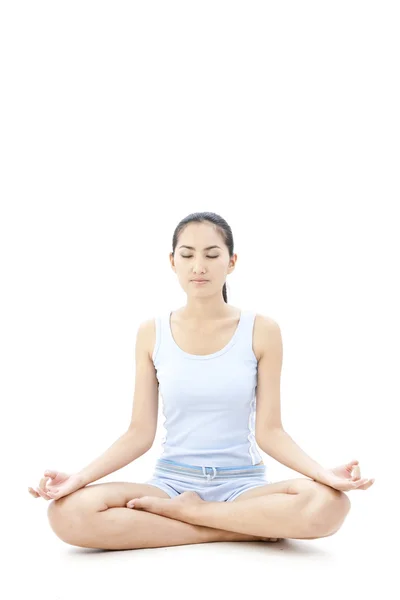 Portrait of pretty young woman doing yoga exercise — Stock Photo, Image