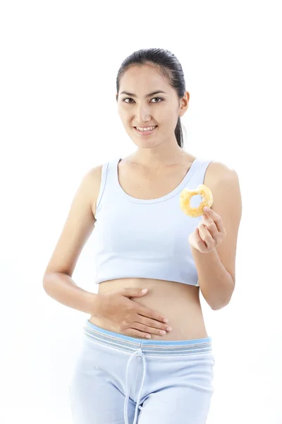 Mulher da dieta segurando donut — Fotografia de Stock