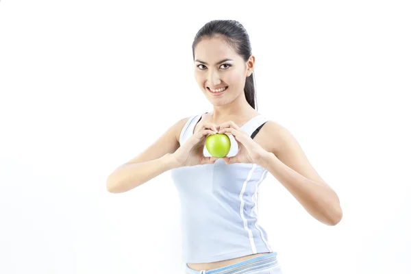 Krásná asijská žena držící zelené jablko na bílém — Stock fotografie