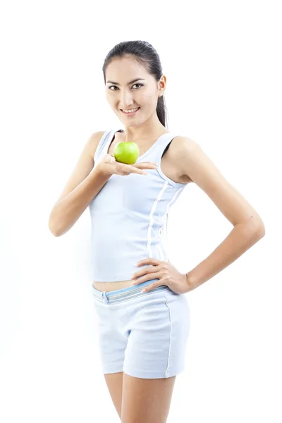 Mooie Aziatische vrouw eten groene appel op wit — Stockfoto