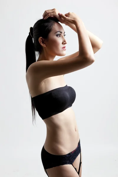 Tiros de uma mulher sexy em preto — Fotografia de Stock