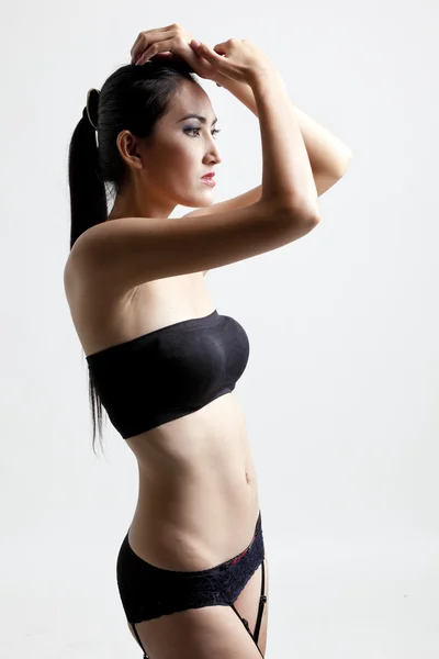 Tiros de uma mulher sexy em preto — Fotografia de Stock