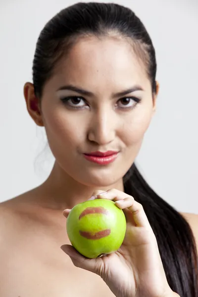 Shot of a sexy woman in black hand holding apple — Zdjęcie stockowe