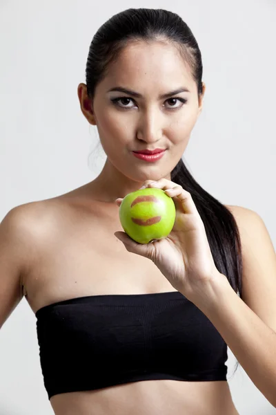 Shot van een sexy vrouw in black hand met apple — Stockfoto