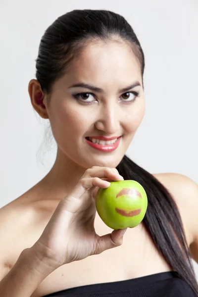 Shot of a sexy woman in black hand holding apple — Zdjęcie stockowe