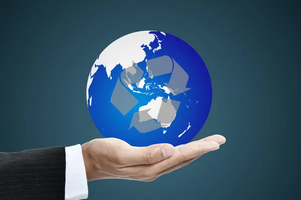 Business hand holding a globe with increasing graph — Stock Photo, Image